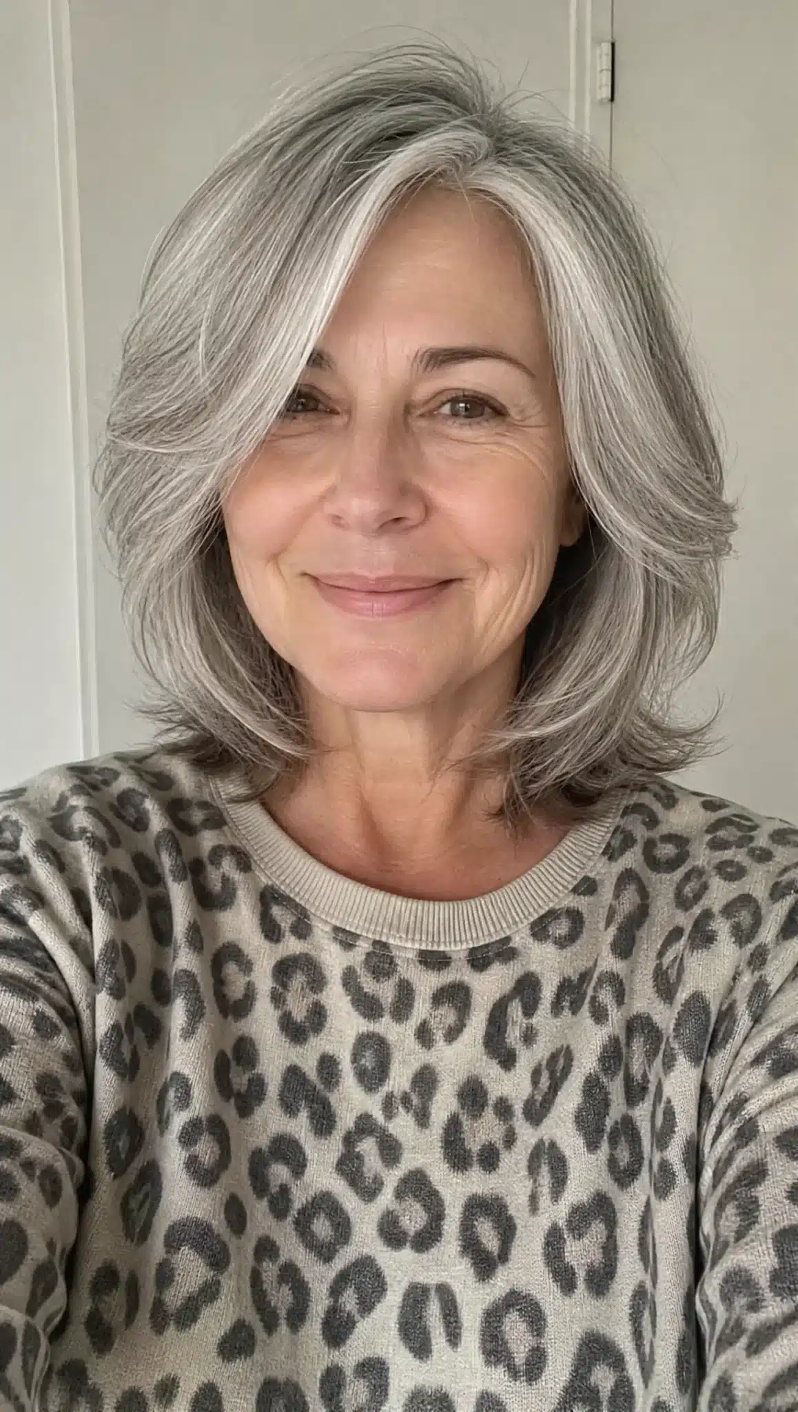 27 Chic Shoulder Length Hairstyles For Women Over 60 5 Feathered shoulder cut with silver gray hair featuring 27 chic shoulder length hairstyles for women over 60.