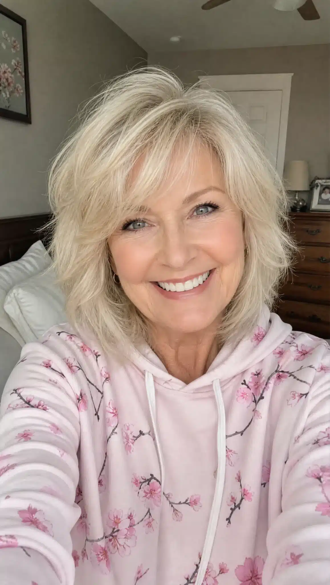 27 Chic Shoulder Length Hairstyles For Women Over 60 8 Wispy layered cut with pearl blonde hair representing 27 chic shoulder length hairstyles for women over 60.