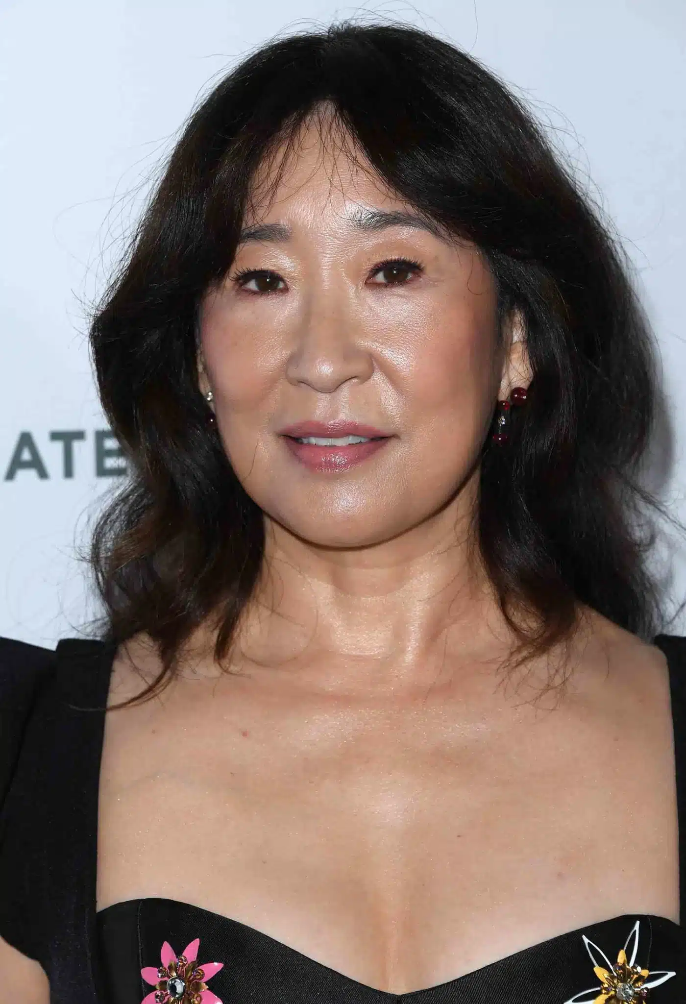 Sandra Oh wearing curtain bangs as part of 35+ Polished Low-Maintenance Medium-Length Haircuts