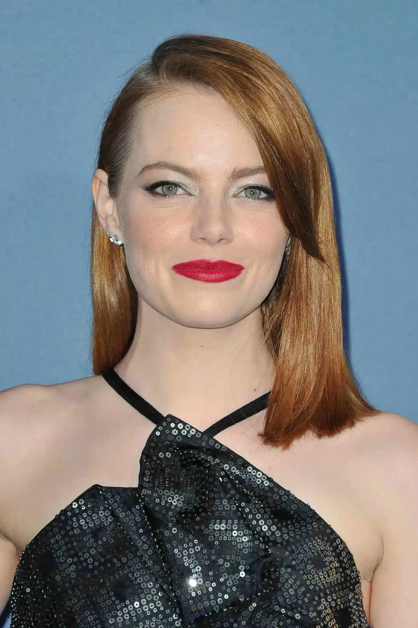 Emma Stone modeling a side bang cut in 35+ Polished Low-Maintenance Medium-Length Haircuts