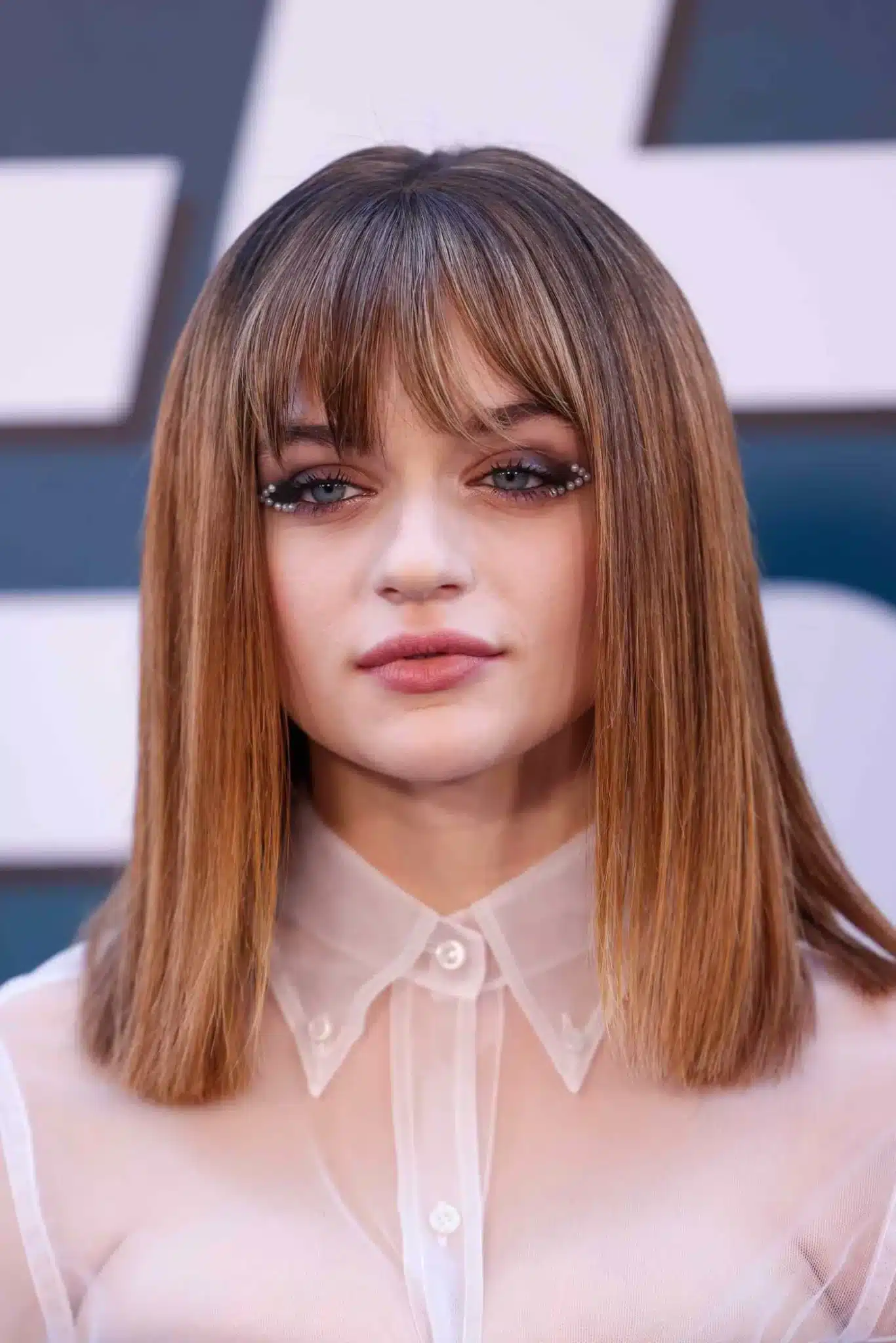 Joey King modeling a blunt bang cut from 35+ Polished Low-Maintenance Medium-Length Haircuts
