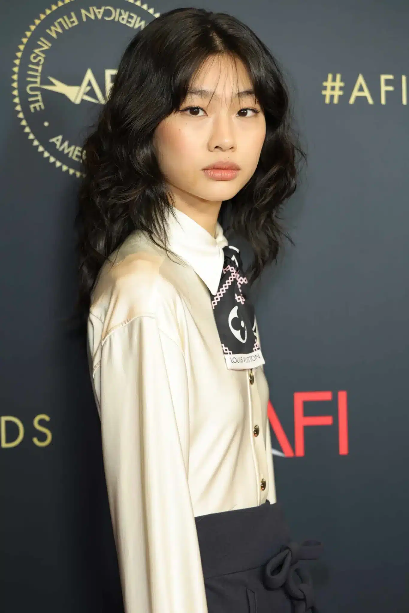 HoYeon Jung modeling a voluminous wavy cut from 35+ Polished Low-Maintenance Medium-Length Haircuts