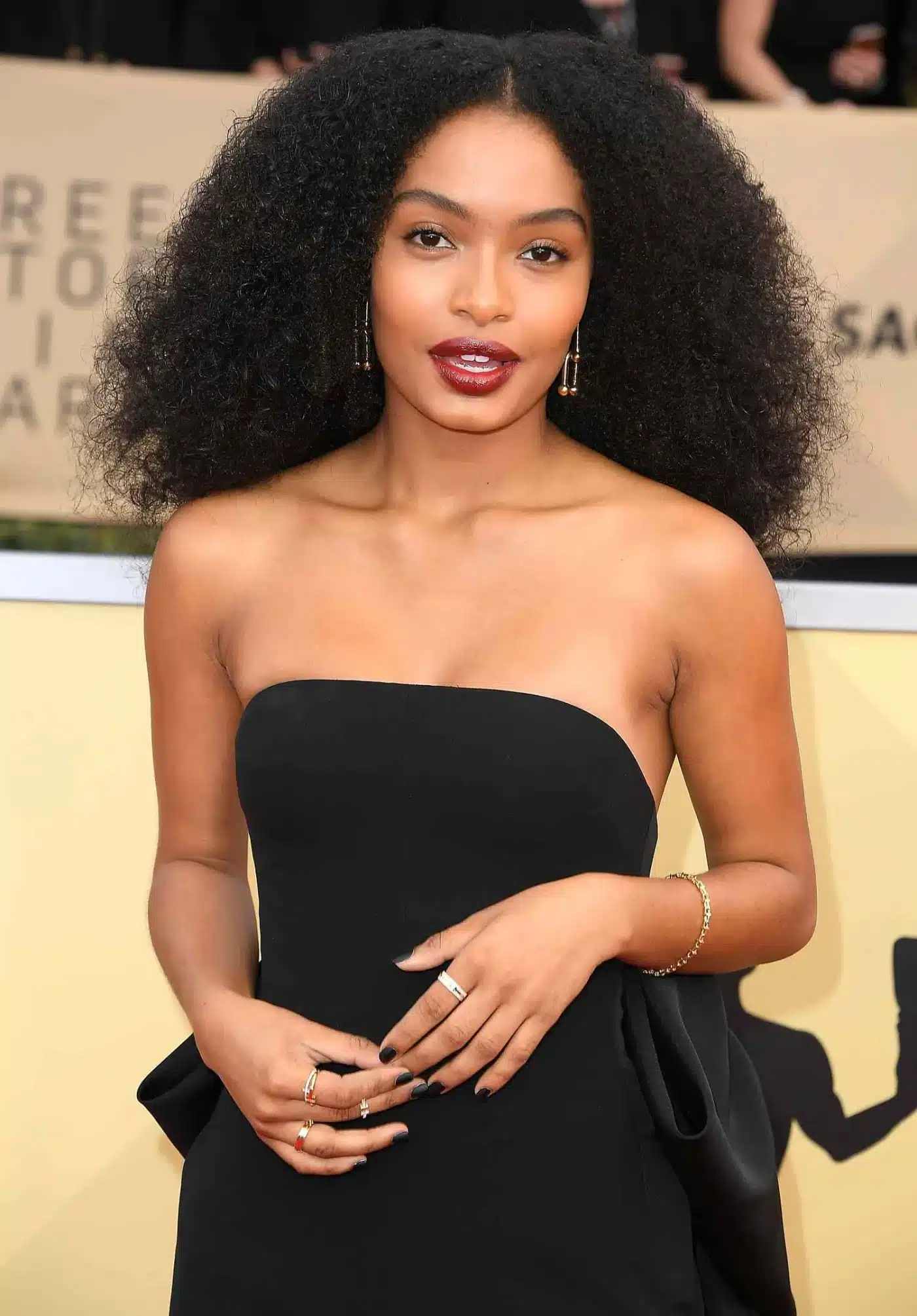 Yara Shahidi embracing natural curls in 35+ Polished Low-Maintenance Medium-Length Haircuts
