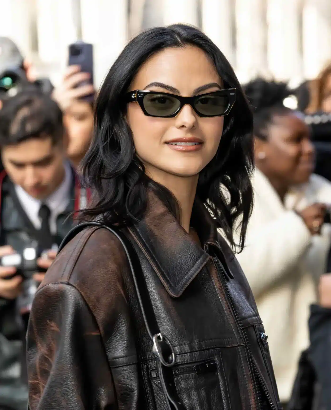 Camila Mendes showcasing blended layers in 35+ Polished Low-Maintenance Medium-Length Haircuts