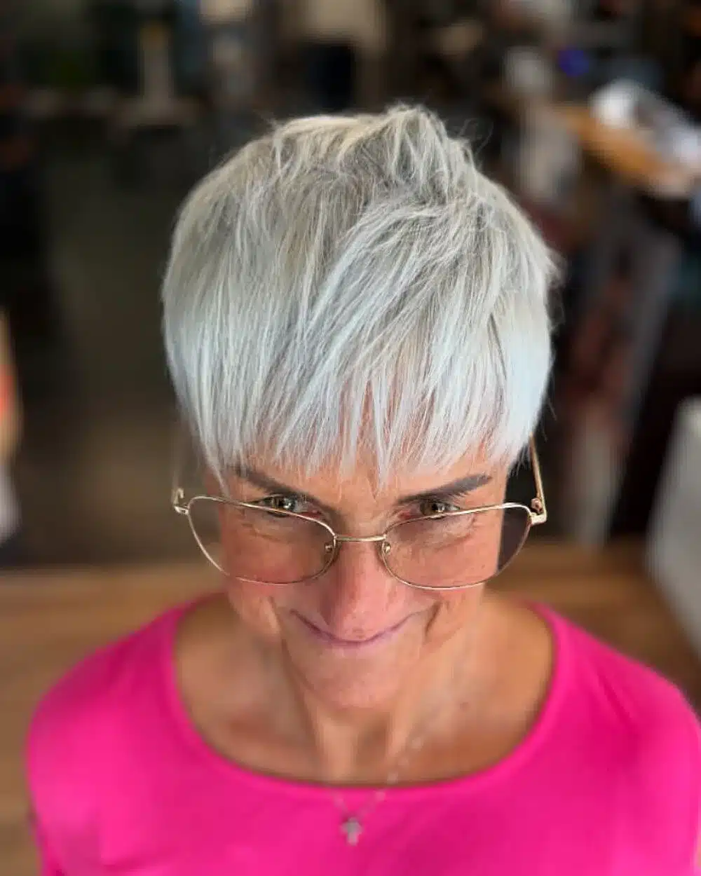 52 Perfect Pixie Haircuts for Women Over 70 to Pull Off 31 Textured silver pixie with bangs for women over 70 featuring layered crown and wispy fringe